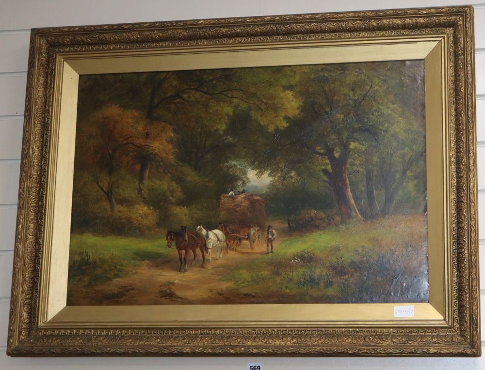 Late 19th century English School, oil on canvas, Harvest cart on a wooded lane, monogrammed JH, 50 x 75cm
